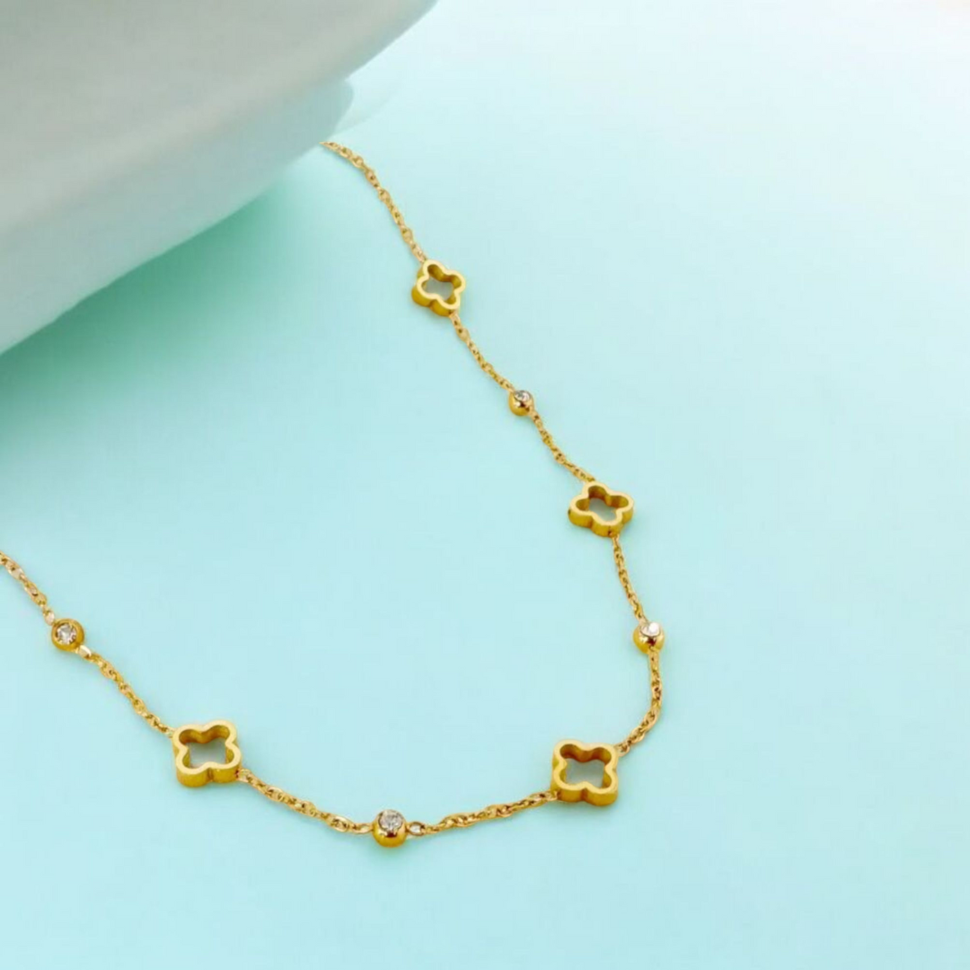Gold necklace with clover-shaped pendants