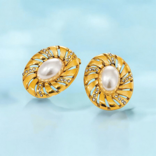 Gold earrings with pearl center on a light blue background jooelri jewelry waterproof stainless steel skin safe 18k gold plated