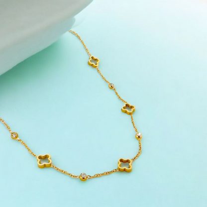 Gold necklace with clover-shaped pendants